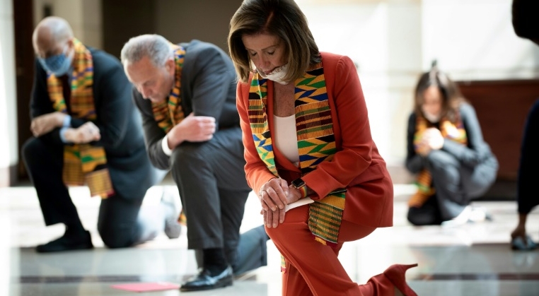 House Speaker Nancy Pelosi and other Democratic lawmakers take a knee to observe a moment of silence on Capitol Hill for George Floyd and other victims of police brutality. AFP