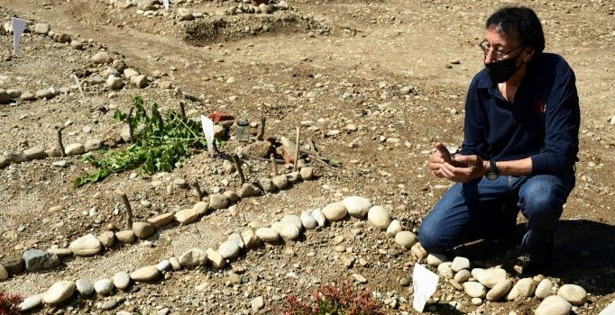 Morocco's Mustapha Moulay prays before his wife's simple grave. AFP