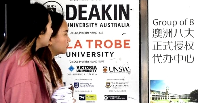 People walk past signage for Australian universities in Melbourne's central business district. AFP People walk past signage for Australian universities in Melbourne's central business district. AFP