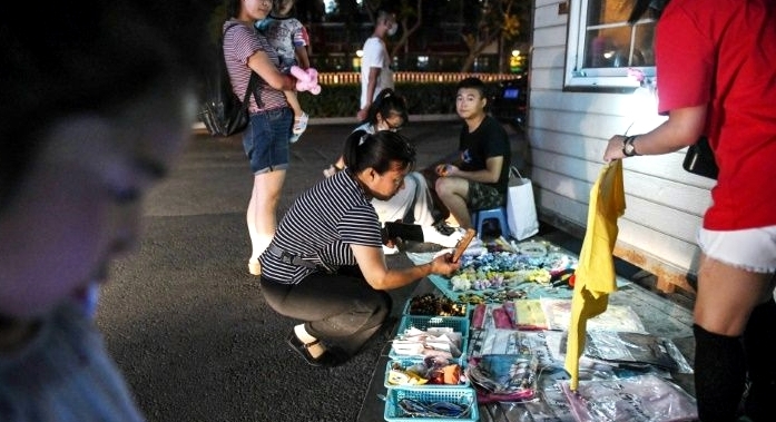 During a visit to the northeast last week, Li Keqiang told street stall holders they were a key part of the economy. AFP
