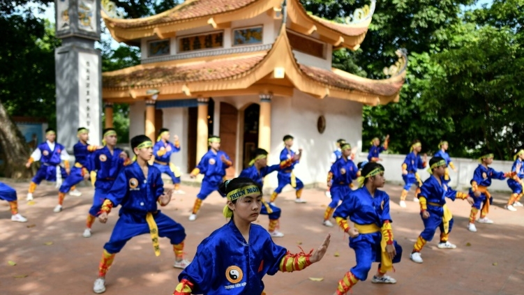 Thien Mon Dao martial arts students practise inside the Bach Linh temple compound at Du Xa Thuong village in Hanoi. AFP