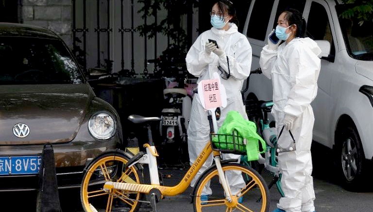 In Beijing a fresh virus cluster linked to a wholesale food market has fueled fears of a second wave of infection. AFP