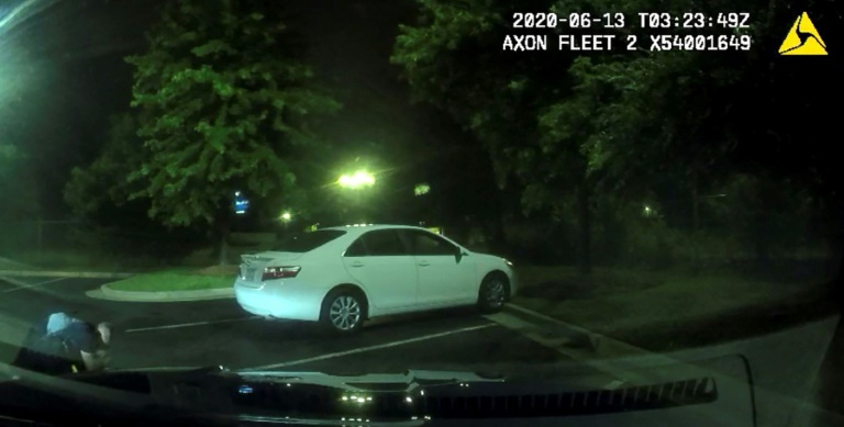 Undated handout photo from Atlanta Police Department shows a video image of struggle between police officers and Rayshard Brooks (L). AFP Undated handout photo from Atlanta Police Department shows a video image of struggle between police officers and Rayshard Brooks (L). AFP