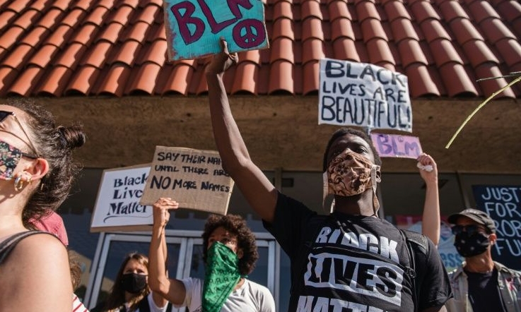 Demonstrators march in Palmdale demanding justice for Robert Fuller. AFP Demonstrators march in Palmdale demanding justice for Robert Fuller. AFP