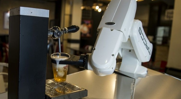 A robot now pulls beers at one bar in the Spanish city of Seville. AFP