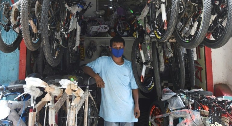 Pedaling to work or school is becoming the new normal for many people in Dhaka. AFP