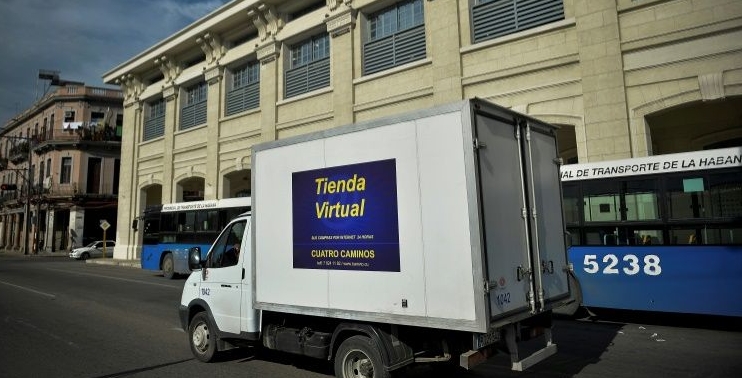 A virtual store truck drives along a street in Havana. AFP