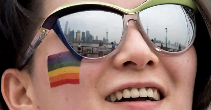 A Shanghai Pride participant poses for a picture during a break. AFP