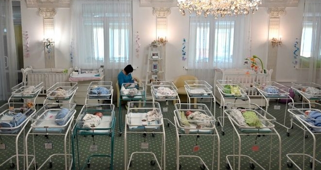 A nurse takes care of newborn babies at Kiev's Venice hotel. AFP