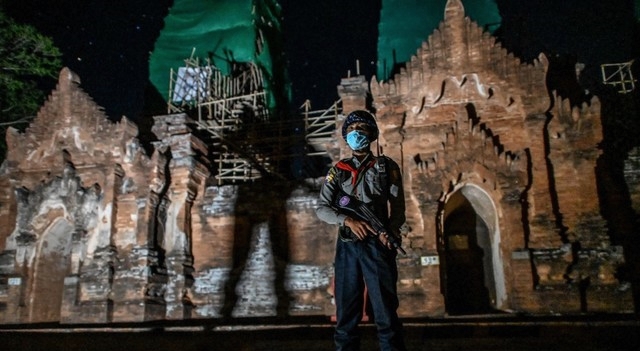 A policeman standing guard around a temple complex in Bagan. AFP