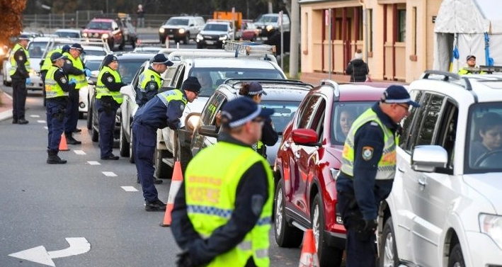 Queues of cars were backed up at Victoria's border after neighboring New South Wales closed the boundary. AFP