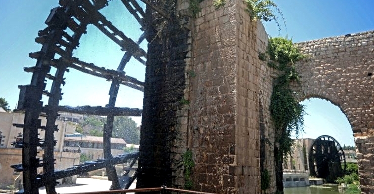 Two ancient water wheels, known as norias, along the Orontes river in the city of Hama. AFP