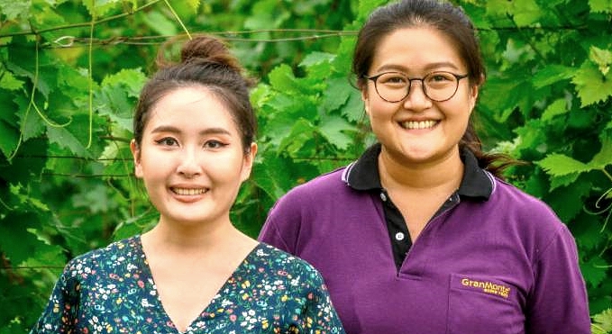 Mimi (L) and Nikki Lohitnavy at their GranMonte Vineyard and Winery in Nakhon Ratchasima. AFP