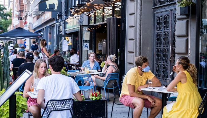People dining al fresco in the East Village in New York City. AFP