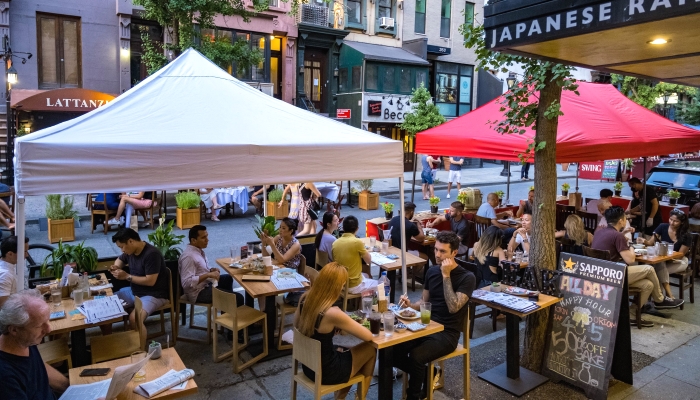 People dining al fresco in in Hell's Kitchen in New York City. AFP