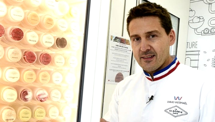 Ice cream maker David Wesmael wearing his white laboratory coat with its tricolore collar, which can only be worn by a tiny elite of the country's best craftspeople. AFP