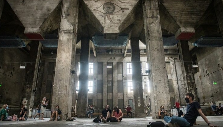 Visitors to the former power plant listen to the eerie sound installation after Berlin's Berghain club re-opens its doors. AFP