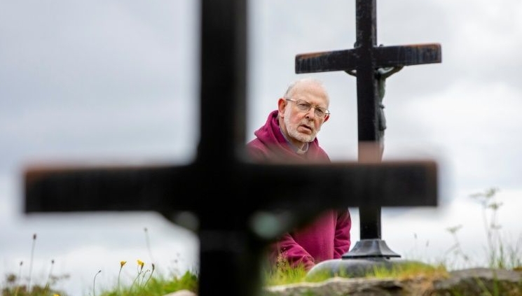 Father Laurence Flynn has been holding vigil at Lough Derg since lockdown began. AFP