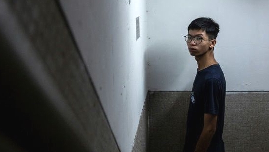 Tony Chung in the stairwell where he says police from the national security unit took him after he was detained. AFP