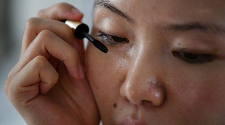 Xiao Jia gives make-up and yoga classes to visually impaired women in China, and encourages them to explore options other than the pre-determined ones. AFP