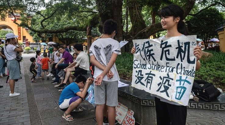 Staging a climate protest in Guilin, Ou has faced run-ins with police, family pressure, and harsh online criticism. AFP