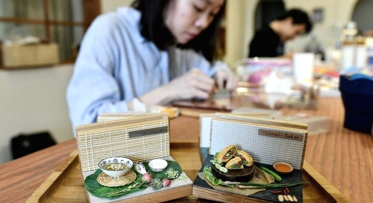 Nguyen Thi Ha An started crafting food miniatures a year ago. AFP