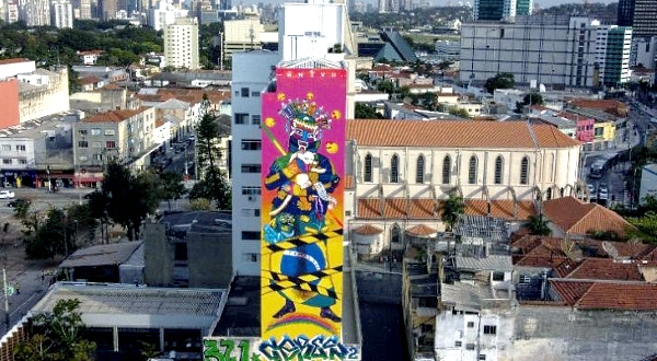 Perched atop a platform swaying in the air 10 stories high, Paola Delfin is putting the final touches on a giant graffiti mural in the sprawling concrete jungle of Sao Paulo.AFP