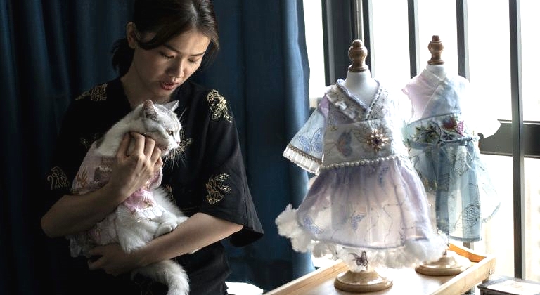 Pet clothing designer Wu Qiuqiao sells up to a thousand dresses a month in China. AFP