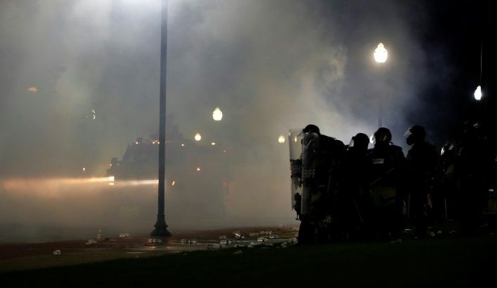 Protesters clash with Kenosha County Sherriff's officers in front of a courthouse during demonstrations against the shooting of Jacob Blake in Kenosha. AFP Protesters clash with Kenosha County Sherriff's officers in front of a courthouse during demonstrations against the shooting of Jacob Blake in Kenosha. AFP