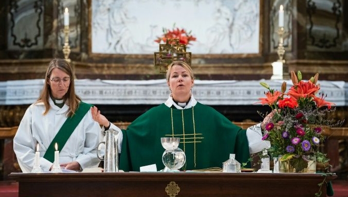 Sandra Signarsdotter leads the Sunday service at Gustaf Vasa Church in Stockholm. AFP