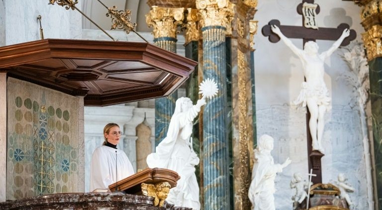 Theology student Julia Svensson preaches from the pulpit, something Anna Howard Shaw was denied in 1911. AFP