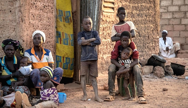 Women and children sit outside a house in a district that welcomes Internally Displaced People (IDP) from northern Burkina Faso in Kaya. AFP Women and children sit outside a house in a district that welcomes Internally Displaced People (IDP) from northern Burkina Faso in Kaya. AFP