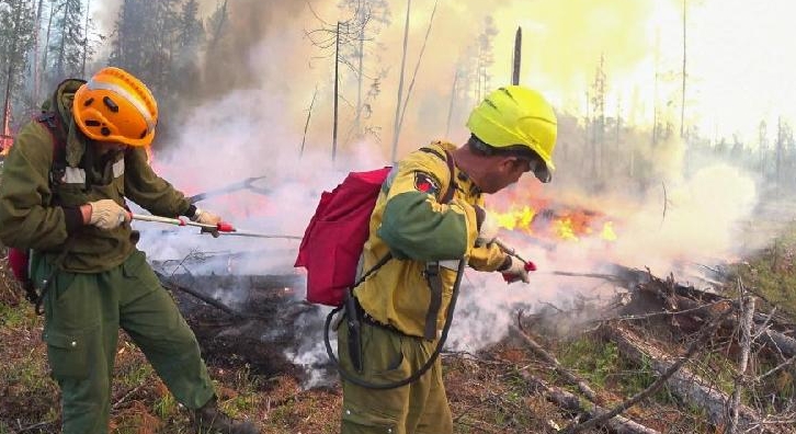 Aerial Forest Protection Service employees trying to extinguish forest fires in Russia. AFP Aerial Forest Protection Service employees trying to extinguish forest fires in Russia. AFP