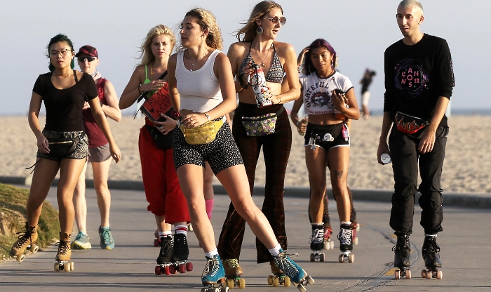 People roller skating along the Venice Beach boardwalk in Venice, California, during the coronavirus pandemic in search of outdoor activities amidst lifestyle restrictions due to the virus. AFP People roller skating along the Venice Beach boardwalk in Venice, California, during the coronavirus pandemic in search of outdoor activities amidst lifestyle restrictions due to the virus. AFP