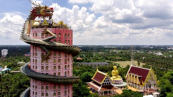 The 16-storey jewel-pink tower, with a dragon slithering up it, symbolizes the 16 levels of heaven in Buddhism mythology. AFP