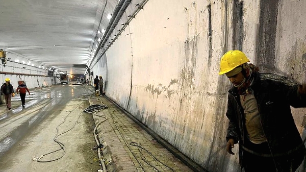 Laborers work inside the Atal Rohtang Tunnel in Himachal Pradesh. AFP