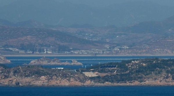 North Korea seen from South Korea's western island of Yeonpyeong, near where Seoul says one of its fisheries officials was shot dead.