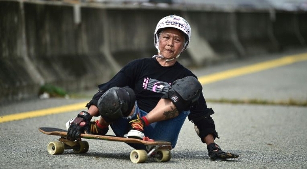 Nongluck Chairuettichai says taking up the longboard in Bangkok sets her on the road to recovery from breast cancer. AFP