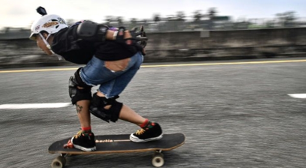 Nongluck Chairuettichai is the oldest member of Thailand's longboard national team. AFP