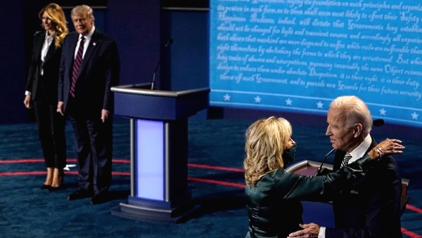 First Lady Melania Trump and President Donald Trump look on as Democratic presidential candidate Joe Biden hugs his wife Jill after the first presidential debate.