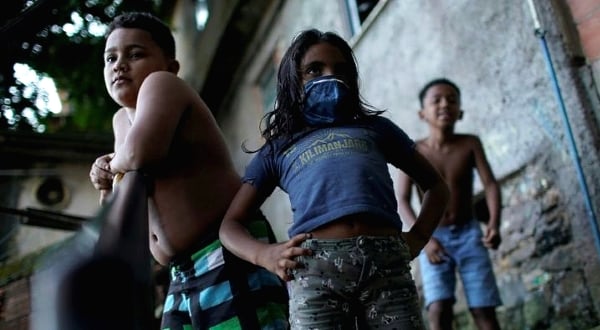 There are few resources for children like these in the Santa Marta favela, or slum, of Rio de Janeiro to take online classes. AFP