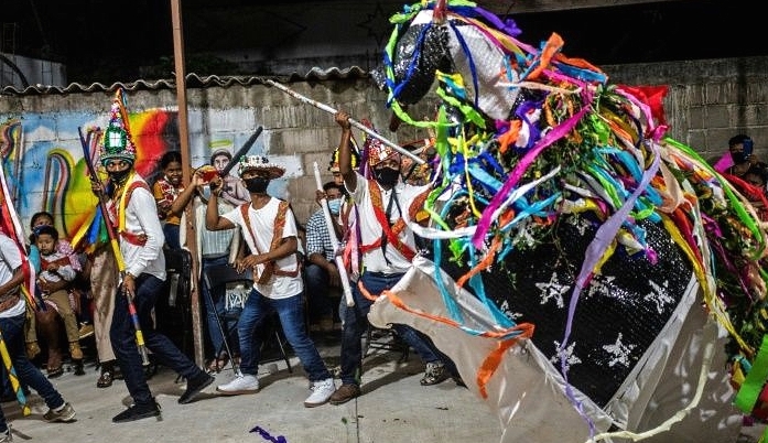 Members of the Afro-Mexican community perform the Dance of the Straw Bull. AFP