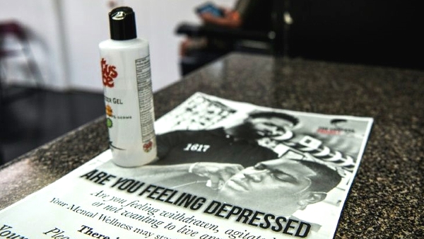 Flyers with information on how to get help for depression are available at Antonio Wiggins's barber shop. AFP