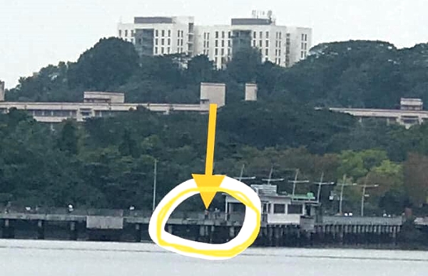 Mohd Izwan's wife took a picture of him standing at the jetty at Woodlands Waterfront Park. Mohd Izwan's wife took a picture of him standing at the jetty at Woodlands Waterfront Park.