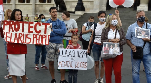 People protesting in front of the Hungarian parliament building in Budapest calling for human rights, free and transparent elections, freedom from violence and for self-determination. AFP