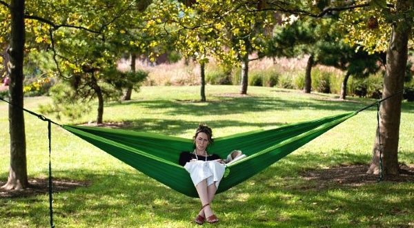 Cait McKay sits in a hammock in Baltimore's Canton neighborhood, one of the city's wealthiest areas. AFP