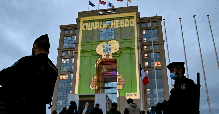 Cartoons of French satirical weekly newspaper Charlie Hebdo projected onto the façade of Hôtel de Région in Montpellier during a national homage to French teacher Samuel Paty who was beheaded for showing cartoons of Prophet Mohamed in his civics class.  AFP
