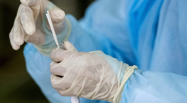 A health worker puts swabs into a tube after collecting a sample for Covid-19 testing at Sunway Medical Center, Petaling Jaya. AFP A health worker puts swabs into a tube after collecting a sample for Covid-19 testing at Sunway Medical Center, Petaling Jaya. AFP