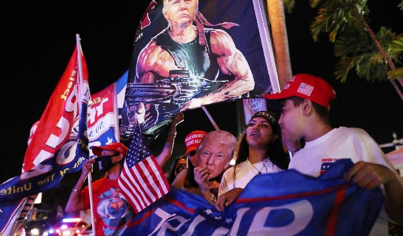 Trump supporters cheer for him outside Versailles restaurant while waiting for the results of the presidential election in Miami, Florida. AFP