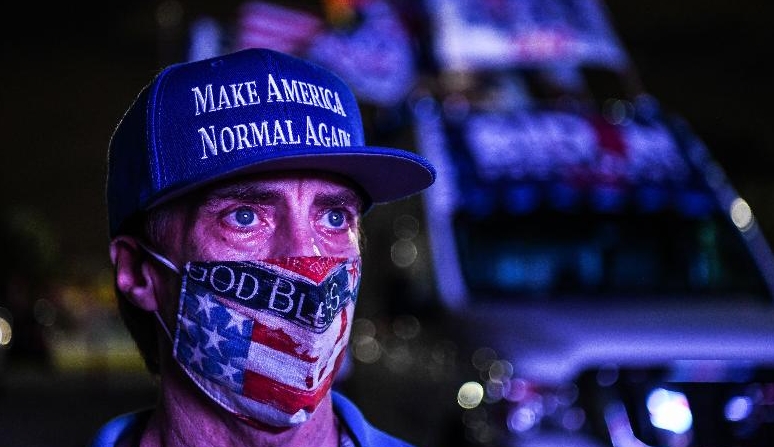 A supporter of the Democratic party attends a watch party in Miami, Florida. AFP
